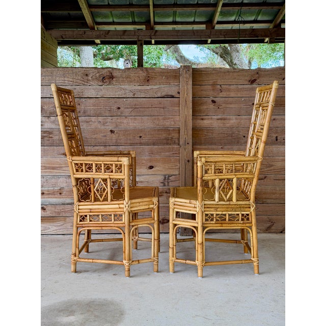 An exceptional pair of vintage rattan and bamboo high-back armchairs featuring incredibly detailed handcrafted...
