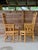 An exceptional pair of vintage rattan and bamboo high-back armchairs featuring incredibly detailed handcrafted...