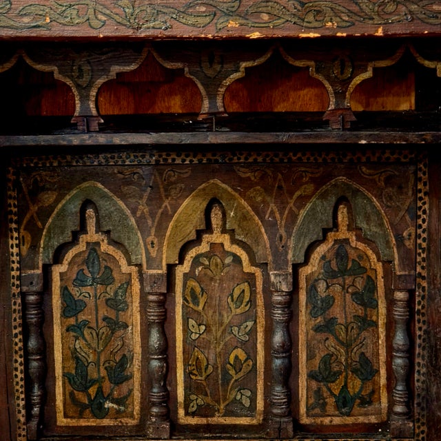 Add warmth and character to your space with this stunning vintage Moroccan wooden wall shelf. Featuring intricate hand-...