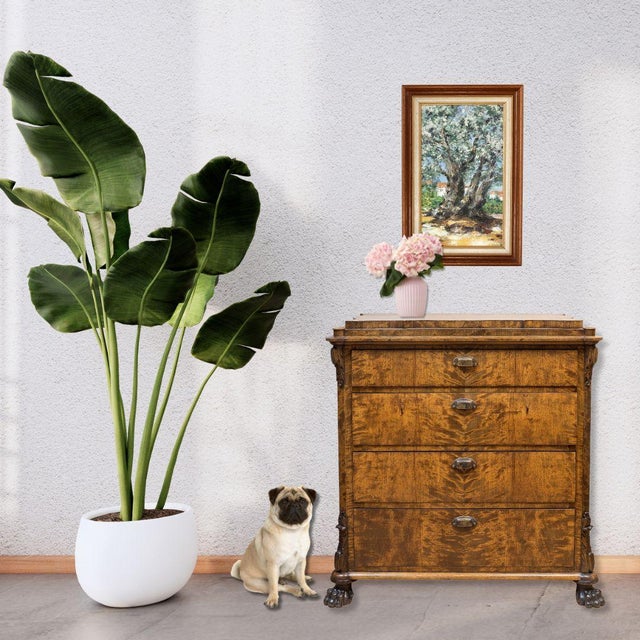 French oil painting of a flowering tree, its thick trunk and twisting branches suggesting centuries of growth. Painted in...