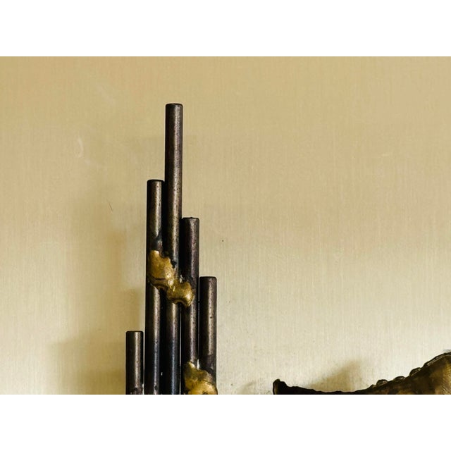 Vintage 1970s Brutalist Metal Wall Hanging. The metal is handcrafted and mounted on to a gold brushed backing. A great...