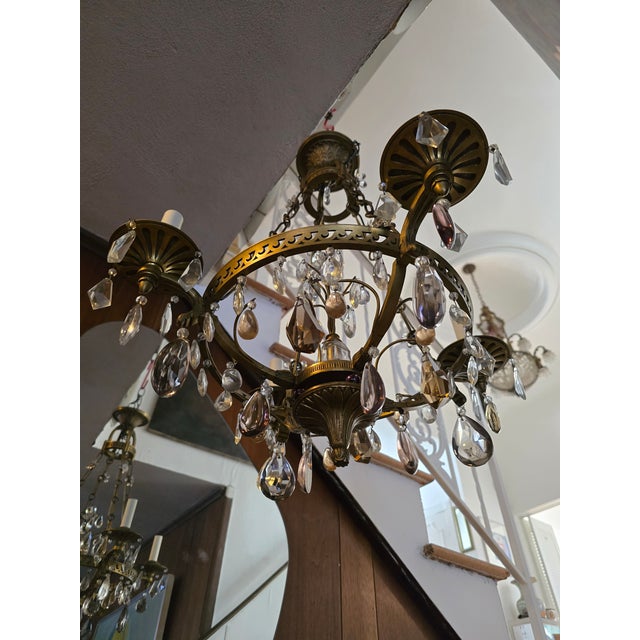 Antique original attributed to French maison bagues bronze and crystal chandelier. Having the finest quality cast bronze...