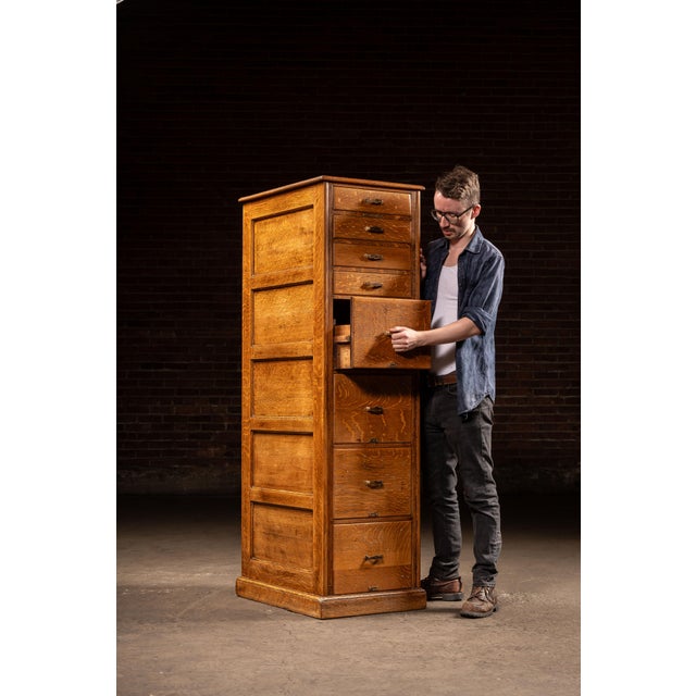 c. 1920s; Library Bureau - Boston, MA / New York, NY Tall quarter-sawn oak vertical file cabinet combining three deep file...
