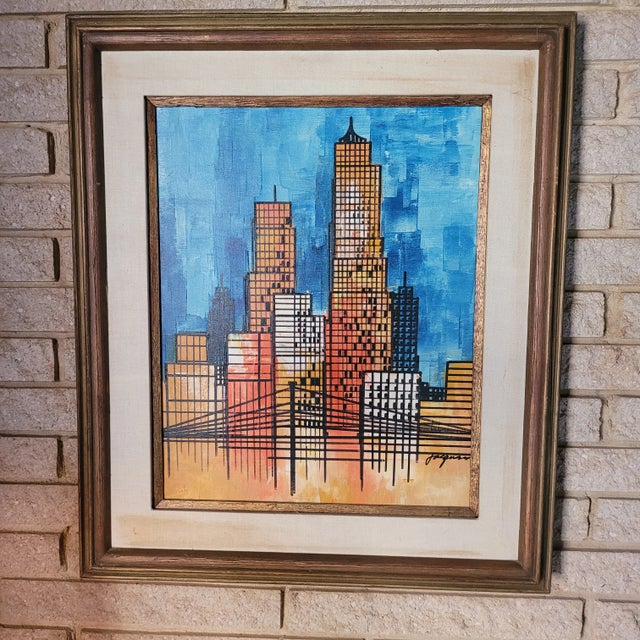 A captivating vintage MCM (Mid-Century Modern) oil painting featuring a vibrant, geometric cityscape signed by Jacques...