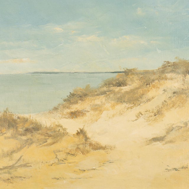 A 1980s Scottish coastal landscape in oil on academy board, depicting dunes above a beach with water and a distant...