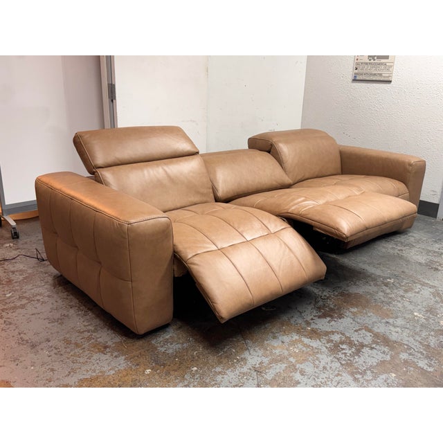 Design Plus Gallery presents the Miles Power Recliner Sofa from Living Spaces. The set of seats is upholstered in leather...