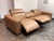 Design Plus Gallery presents the Miles Power Recliner Sofa from Living Spaces. The set of seats is upholstered in leather...