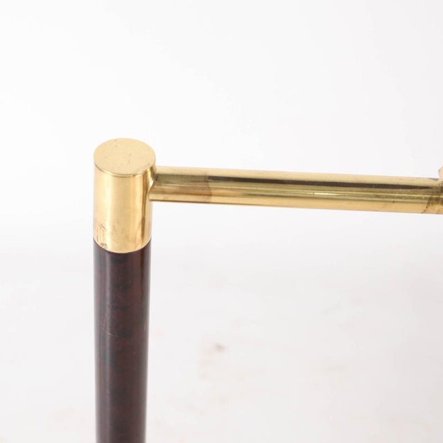 Stunning brass and wood lamps with adjustable shades, dating from the 1970s-1989. Equipped with a switch on the base,...