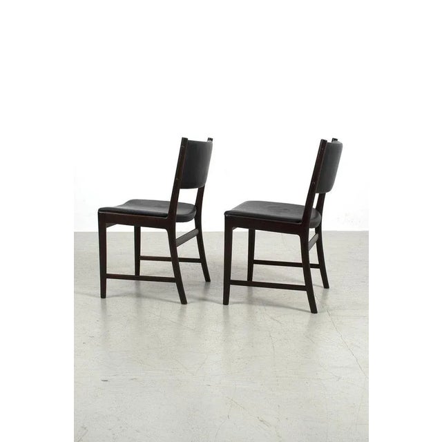 Beautiful pair of kai lyngfeldt larsen chairs made out of rosewood with black leather upholstery. In good vintage...