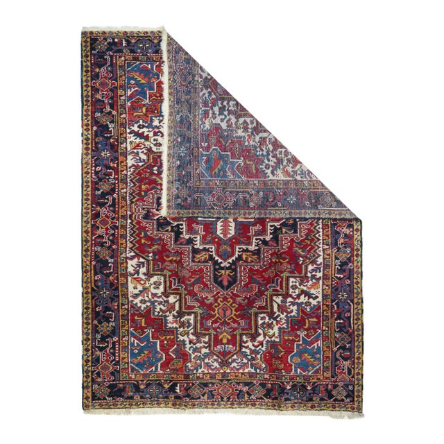This attractive rustic NW Persian room size carpet displays a warm, clear madder red field supporting a version of the...