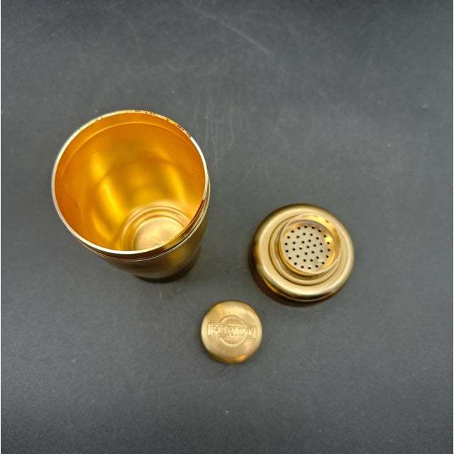 Vintage Martini cocktail shaker, made in Italy in the 1960s; a three-piece shaker with a cork-shaped lid and built-in...