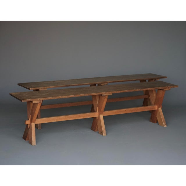 A pair of simple and attractive benches. Oak boards on cherry wood X-frame legs. The thin oak and peg constructed base...