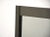 A post modern gunmetal mirror made by Ello. Made in the 1980s.