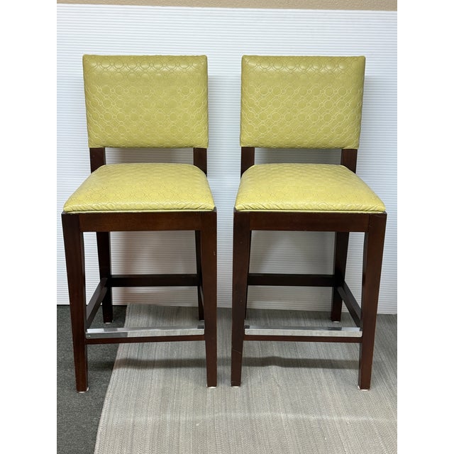 Design Plus Gallery presents a Pair of Oakland Bar Stools by Kravet for Hickory Chair. The stools have a classic frame...