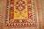 An authentic Turkish Melas rug featuring a bright yellow field. 3'3'' x 4'8''