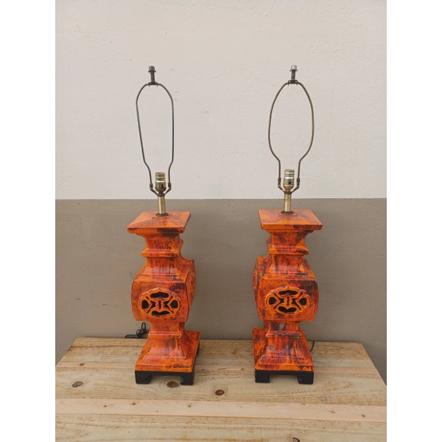 Pair of vinatge mod maverick orange glazed lava lamps with Chinese inspired piercing. Ming style stand. Monumental pieces!