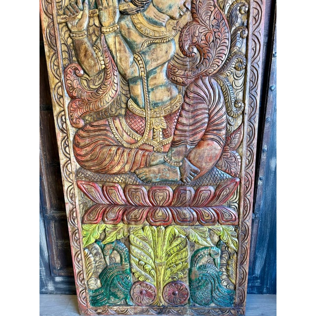 Celebrate the divine beauty of Fluting Krishna with this exquisite Vintage Indian Door Panel, hand-carved in rich detail...
