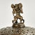 Enchanting antique Moroccan table lamp featuring a dancing monkey finial on a pierced brass shade with floral and animal...