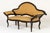 A 18th century italian ebonised sofa. in the rococo style, this ebonised sofa is curvaceous and serpentine in form. The...