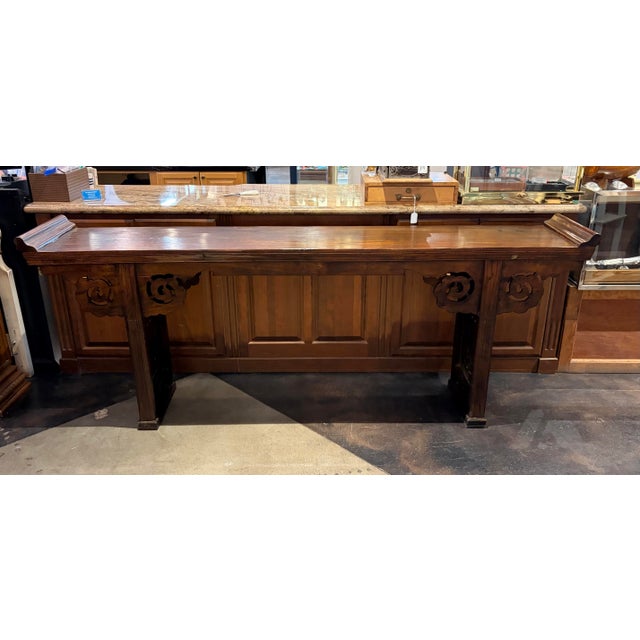 Traditional Chinese altar table (or console table) featuring upturned "everted" ends, intricate hand-carved cloud apron...
