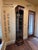 Great looking tall narrow open display with glass shelves and smokey mirrored back. Each shelf has a carved notch for...