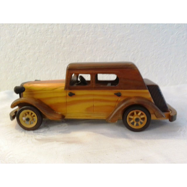 Cool pair of model antique all wood cars with rolling wheels. Beautifully detailed. Dimensions: roadster, 15"L x 5.25"W x...