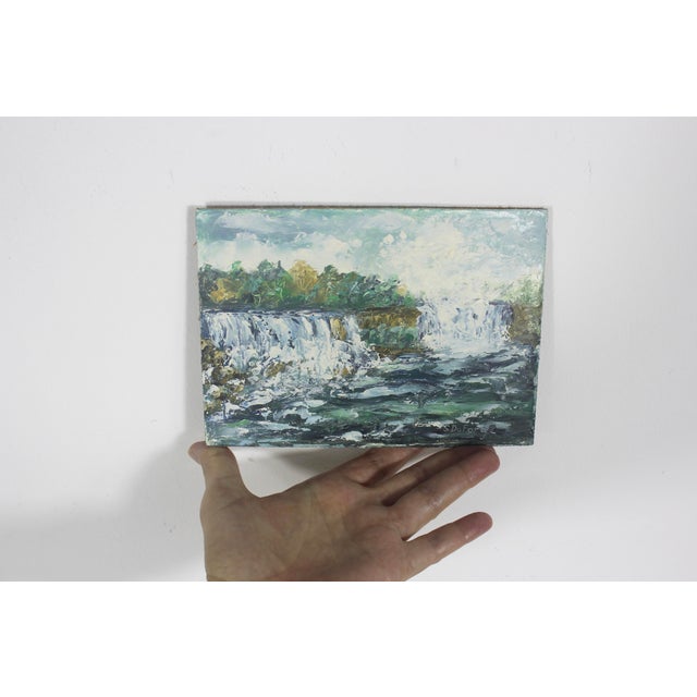 Vintage oil painting of Niagara Falls. This is signed by the artist and is small and unframed. The painting is in good...