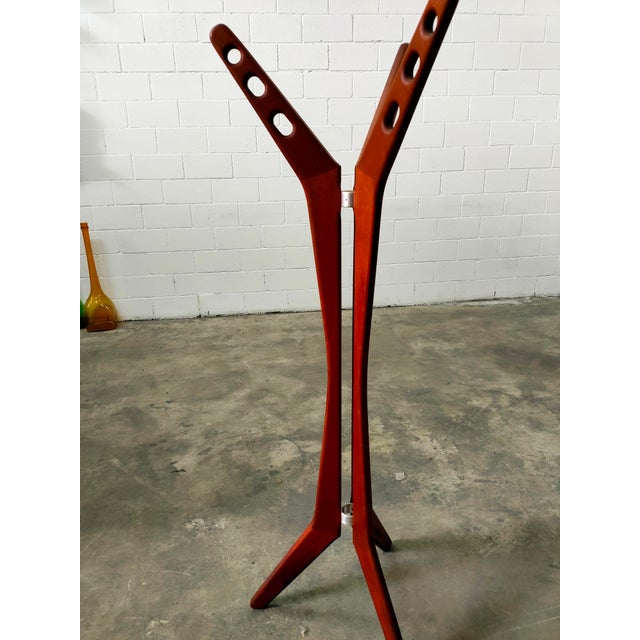 Coat rack made of teak wood in Denmark, 1970s. Measurements: height 165cm, base 65cm.