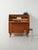Scandinavian teak writing desk with oak inserts, three large drawers, a pull-out shelf, and a roller shutter. Decorated...