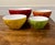 This is a set of four vibrant, ribbed nesting bowls designed for versatile use in the kitchen, from mixing ingredients to...