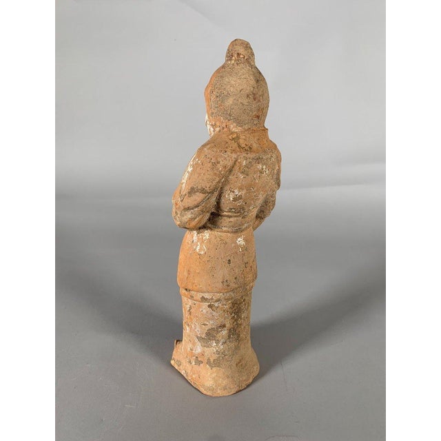 Tang Dynasty terracotta sculpture , painted with a white slip, depicting a soldier . In pristine condition (no restoration...