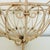 Pair of vintage painted wrought iron hanging plant holders. Each is approximately 12" in diameter, 11" in height, and 24"...