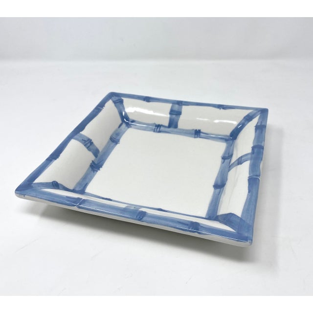 A ceramic tray hand-painted in Italy to resemble woven bamboo fretwork, with visible brushstrokes rather than a printed...