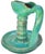 Antique handcrafted and glazed Moroccan teal green ceramic oil lamp with handle, featuring an elaborate silhouette and...