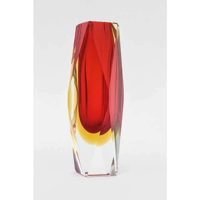 This beautiful vintage Murano Alessandro Mandruzzato Sommerso vase is faceted glass. It is red to yellow to clear glass on...
