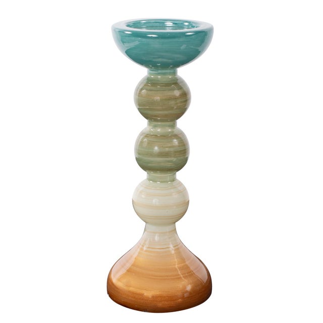 A vibrant assortment available in multiple sizes and shapes. The candle holders showcase a stunning ombre effect,...