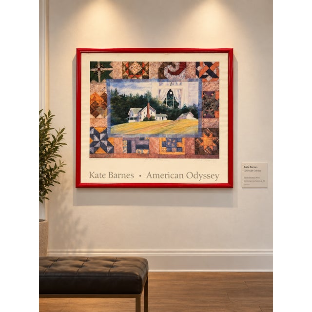 Framed art print of Kate Barnes’ “American Odyssey”: a pastoral farmhouse landscape inside a patchwork border of quilt-...
