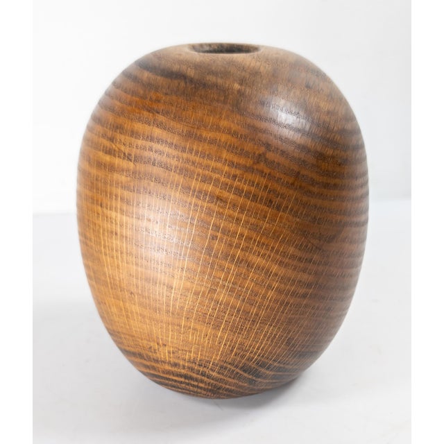 We are selling this cool Mid-Century modern oval or ovoid shaped vase. This studio made piece has partial branded...