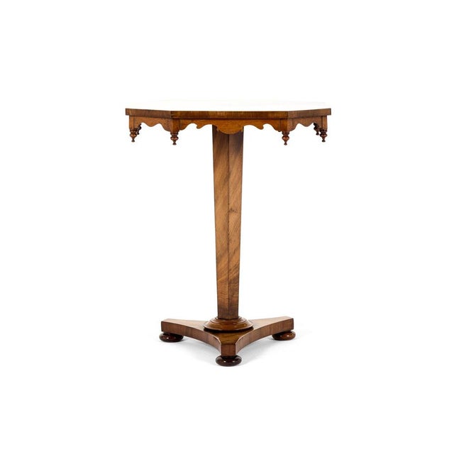 An unusual early victorian mahogany occasional table with a rectangular shaped top with canted corners. Beneath the...