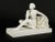 This is a magnificent antique French Art Deco bisque porcelain model of a seated nude woman with flowers by the sculptor...