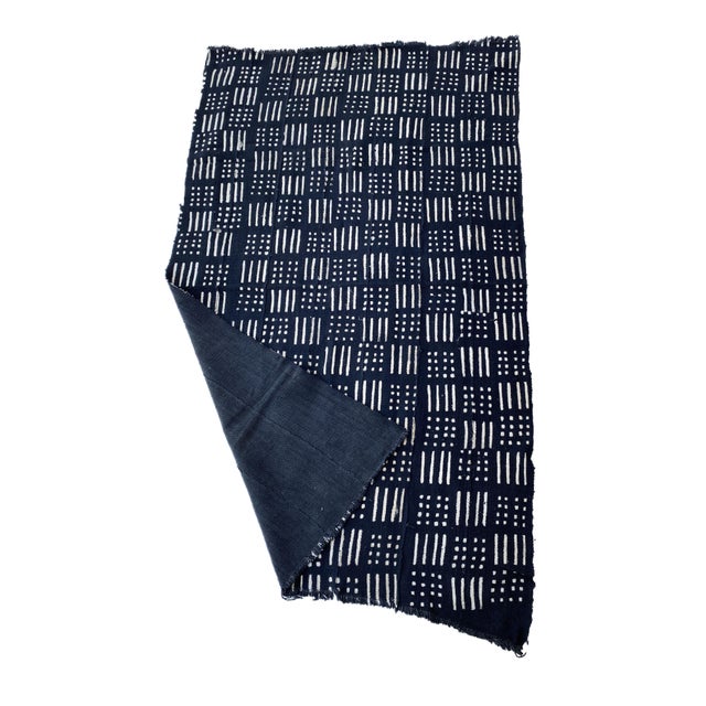 Meticulously handcrafted from 100% cotton, this authentic mud-cloth textile is created by the skilled artisans of the...