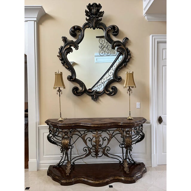 This beautifully oversized wall mirror will be an impressive addition to any grand foyer. The unique frame is made of...