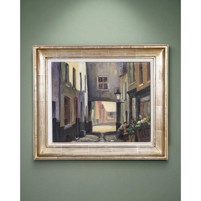 This atmospheric oil painting by belgian artist ferdinand jorwitz (1897–1979) draws us into a narrow old street, where...