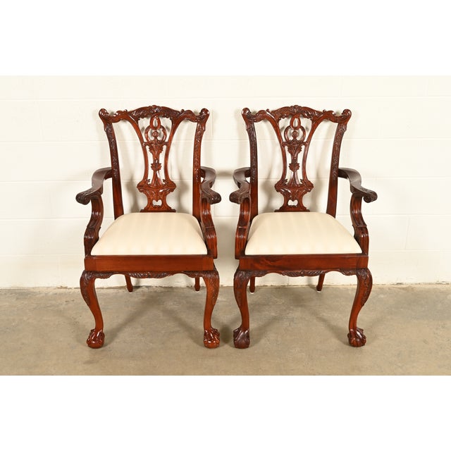 An outstanding pair of Chippendale or Georgian style armchairs or dining captain chairs In the manner of Baker Furniture...