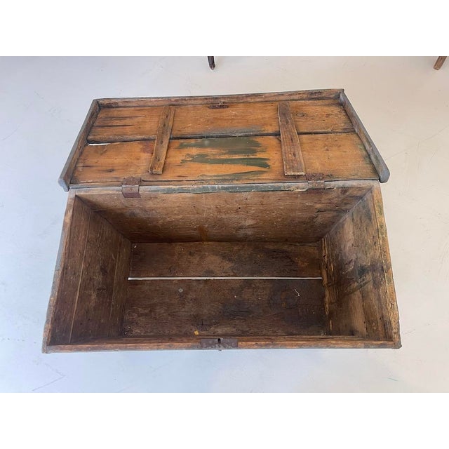 Antique Primitive Painted Wood Trunk with Original Patina A substantial early-20th-century painted wood trunk with an...