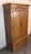 Tall wardrobe by Thomasville for their La Galerie series. Features warm pecan wood with honeycomb front doors. Ample...