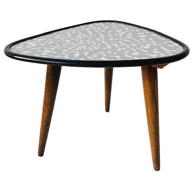 Vintage mid-century triangular Rockabilly plant table from the 1950s with gray and white checked Formica and black piping....