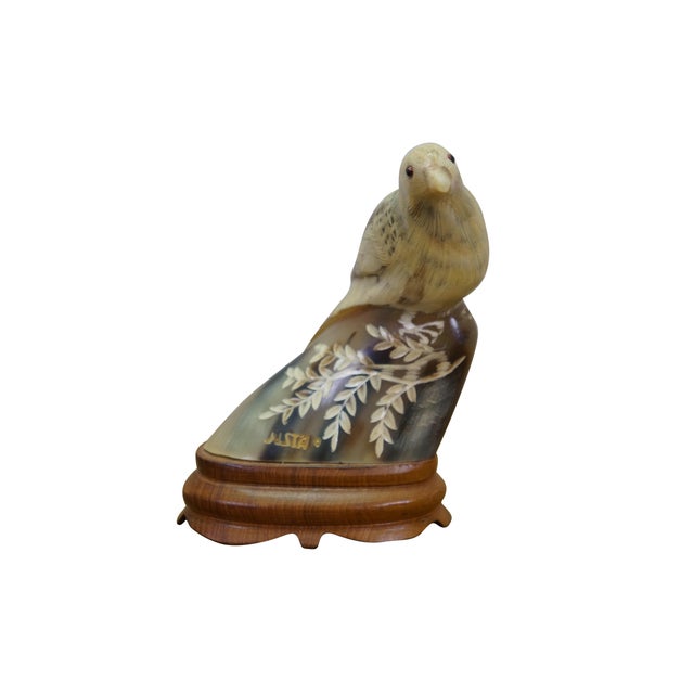 This Justa signed folk art sculpture is a finely detailed depiction of a bird perched on an organic branch, beautifully...