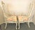Pretty vintage Italian solid wood arm chairs. The solid wood frames have been updated with a bright white distressed...