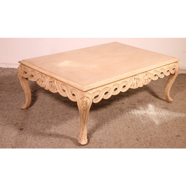 Exquisite Louis XV style coffee table in painted wood. A very beautiful piece featuring a lovely carved frieze and elegant...